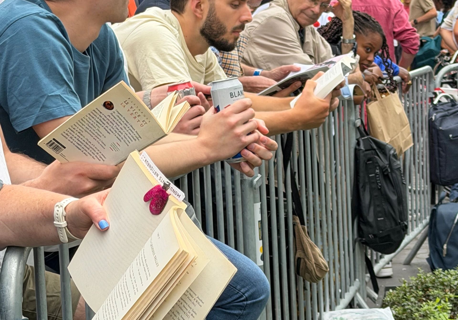Group gathered behind barricades with books