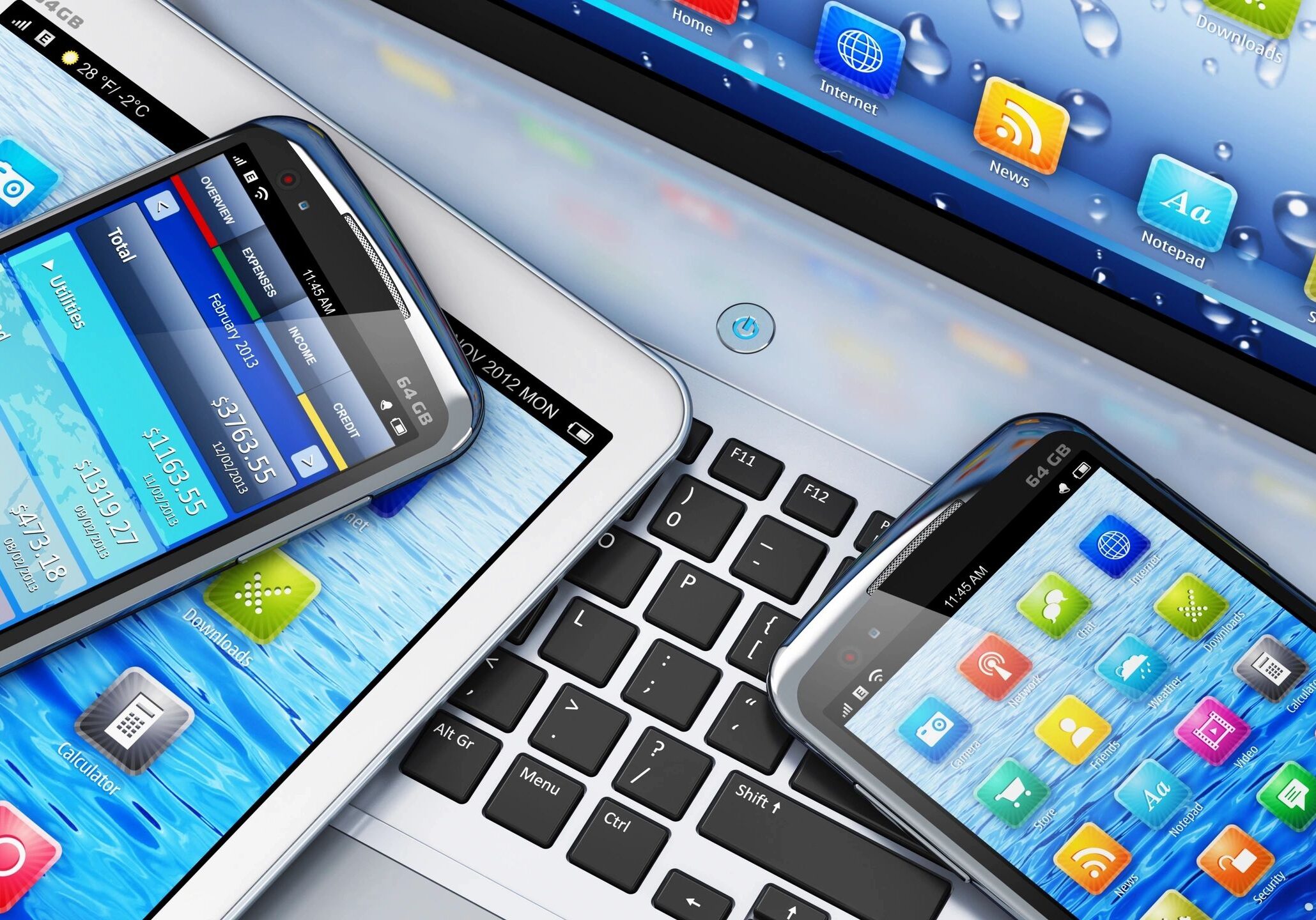 Technology gadgets on computer keyboard